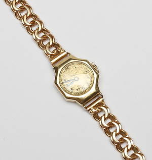  DAMARMBANDSUR, 14k guld samt ARMBAND, 18k guld, vikt totalt 23 gram.