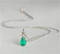 Collier in Weißgold mit Brillanten und Smaragd