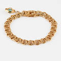 ARMBAND med en BERLOCK