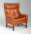 Dansk møbelproducent. Øreklapstol, brunt bøffellæder