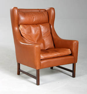 Dansk møbelproducent. Øreklapstol, brunt bøffellæder