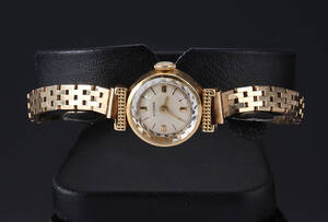 Rilana. Vintage dameur i 18 kt. guld med lænke af 14 kt. guld, 1960erne