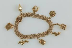 ARMBAND, x-länk, med berlocker, 8 st, guld, 18 k, totalt ca 20,8 g