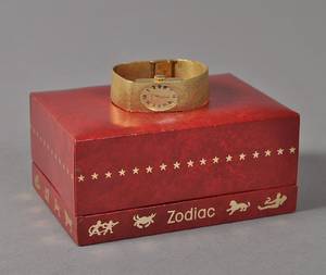 Zodiac dameur i 18 kt guld m lænke i 18 kt. guld i org. æske.