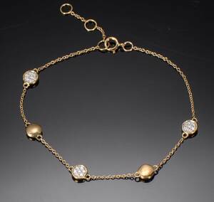 Brillant armbånd af guld prydet med cirkler,ca. 0.11 ct