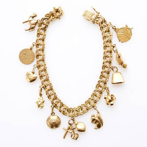 Armband 18 k guld med 11 berlocker