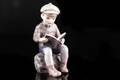 Dahl Jensen. Læsende dreng, figur af porcelæn, dessin 1096