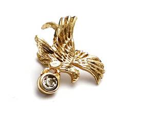 Gulddetalj med diamant