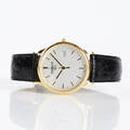 Tissot herrarmbandsur i 18 k guld 
