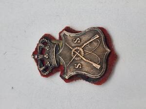 Ærme mærke for lærer ved Skyde skolen ca. 1871