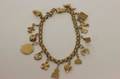 Armband med berlocker 18k