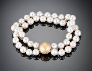 Ole Lynggaard. Kuglelås med perlearmbånd