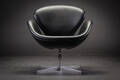Arne Jacobsen. Lounge hvilestol Svanen betrukket med sort læder 