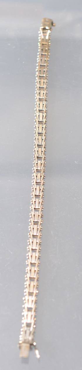 ARMBAND VITGULD 18K