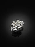 RING, 18 kt vitguld med 9 briljanter 0.60 ct, enligt gravyr.