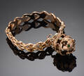 Vintage armbånd prydet med vedhæng, 18 kt. guld