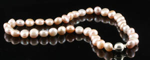 Fresh water pearl necklace .