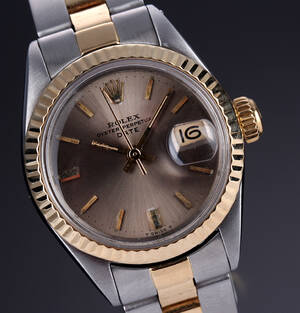 Rolex Date. Vintage dameur i 18 kt. guld og stål med sølvgrå skive, ca. 1971 Denne vare er sat til omsalg under nyt varenummer 4155916
