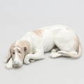 FIGURIN i porslin. Vilande hund. Lladro.