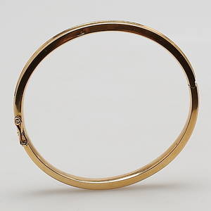 ARMBAND i 18K gulguld, stel öppningsbar armring, märkt 18K.