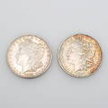 MYNT, 2 st, silverdollar, 1881 samt 1886.