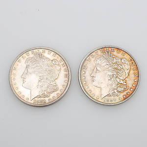 MYNT, 2 st, silverdollar, 1881 samt 1886.