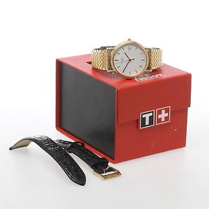 HERRARMBANDSUR, Tissot, quartz, boett av 18k guld.