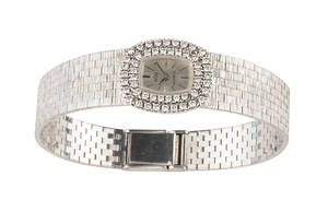 DAMENUHR mit Brillantlünette,  750er Weißgold ca. 44,2 g.