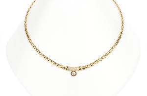 COLLIER. En diamant ca 0,24 ct, 10 diamanter ca 0,13 ct, 585 gult guld ca 21,1 g.
