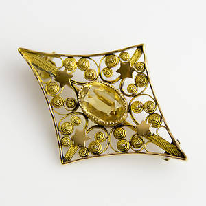 BROSCH, 18K guld med gul sten.