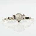 Movado damarmbandsur 18 k vitguld