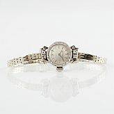Movado damarmbandsur 18 k vitguld