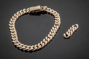 Panserarmlænke af guld 