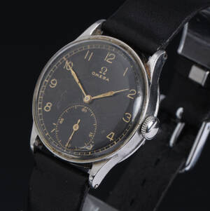Omega. Vintage herreur i stål med sort skive med separat sekundviser, ca. 1938