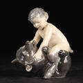 Kgl. P. Figur af porcelæn. Faun med bjørn nr. 648, 1. sort 