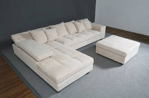 Sofa med chaiselongue og puf, cremefarvet - venstre