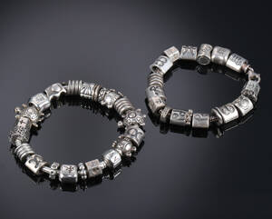 Pandora. To armlænker med charms af sterlingsølv. 2