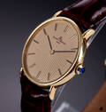 Baume  Mercier. Vintage herreur i 18 kt. guld med champagnefarvet skive, ca. 1980erne 