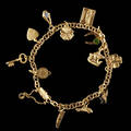 Armband 18 k guld berlocker