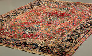 Persisk tæppe med geometrisk mønster på rød bund. 335 x 222 cm.