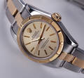 Rolex Oyster Perpetual. Dameur i 18 kt. guld og stål med lys skive, ca. 1998