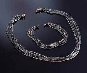 Ole Lynggaard. Armlænke samt halskæde af 14 kt. guld og sterlingsølv 2