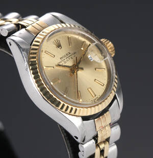 Rolex Date. Dameur i 18 kt. guld og stål med champagnefarvet skive, ca. 1972