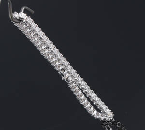 Brillant tennisarmbånd af 10 kt. hvidguld, i alt ca. 1.40 ct
