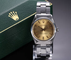 Rolex Oyster Perpetual. Vintage herreur i stål med champagnefarvet skive - boks  cert. 1969