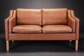 Dansk møbelproducent. To-pers. sofa med brunt læder