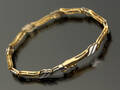 Armbåndlænke af 14 kt. satineretguld og blankt hvidguld. Denne vare er sat til omsalg under nyt varenummer 4941736