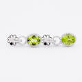 Örhängen i 18 k vitguld peridoter och diamanter