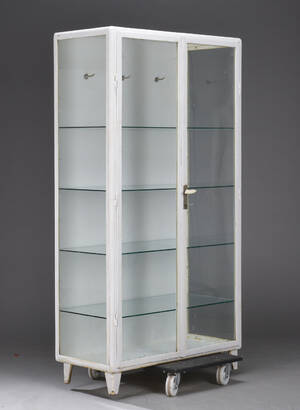 Tandlægeskab af hvidlakeret metal og glas