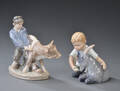 To figurer af porcelæn Royal Copenhagen bestående af  dreng med ged nr 434, dreng med kalv nr, 772  begge 1. sort. 